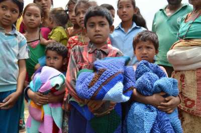 Warm clothes distributed to 300 earthquake survivor families